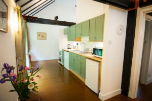 Kitchen towards the front door of the holiday cottage, fully equipped to ensure a great stay in Wiltshire