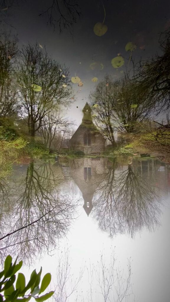 Reflections of a church in the garden of a holiday cottage near Pewsey, Avebury and Marlborough in Wiltshire