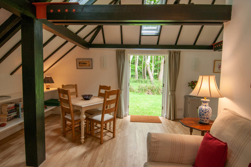 The sitting room area with double doors leading out to the private garden near Pewsey in Wiltshire