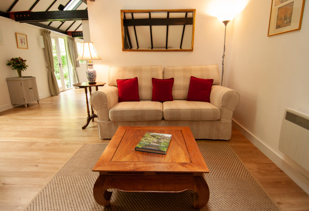 The sitting room area with double doors leading out to the private garden near Pewsey in Wiltshire