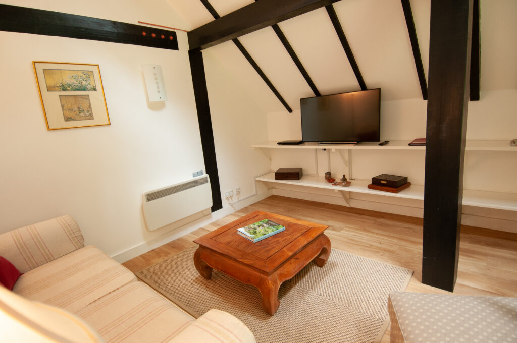 The sitting room area with double doors leading out to the private garden near Pewsey in Wiltshire